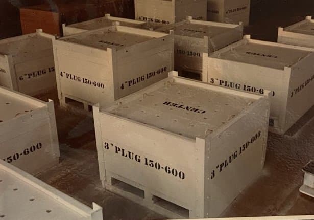 Stenciled plug crates on the shop floor