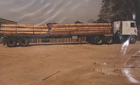 Flatbed truck loaded with timbers