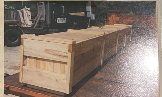 Long custom crate staged for transport